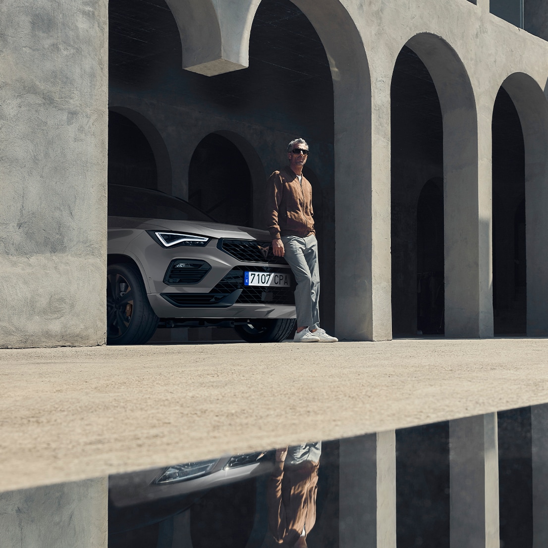 CUPRA driver leaning on his CUPRA Ateca