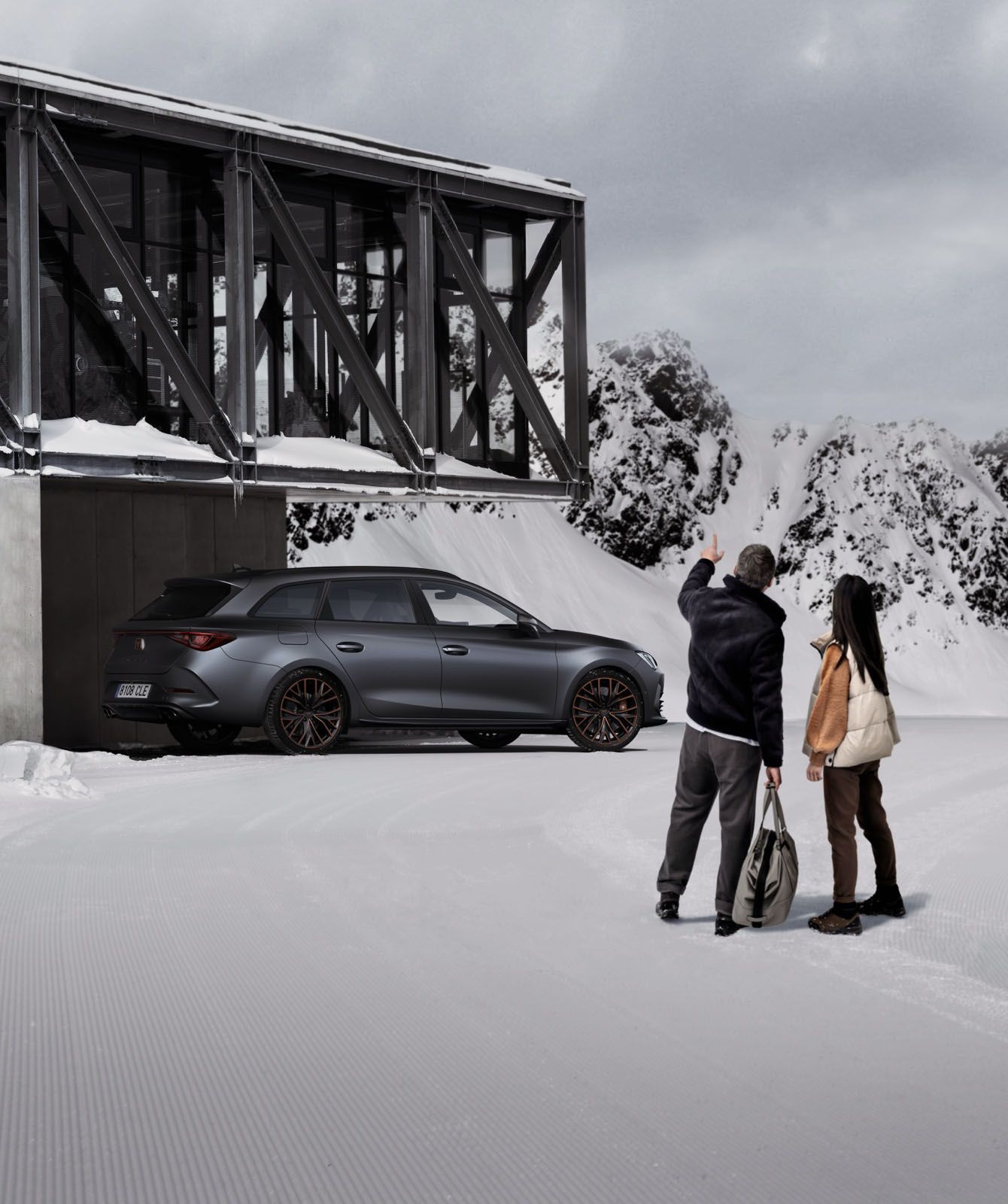 couple-in-front-of-house-in-the-snow